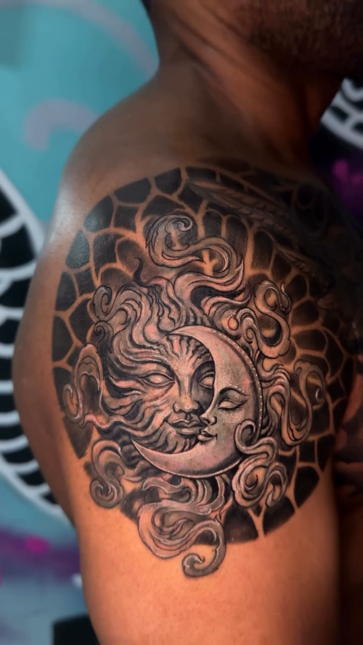 Sun and moon celestial tattoo surrealism tattoo on the shoulder by Tony Hernandez, Chicago, Illinois