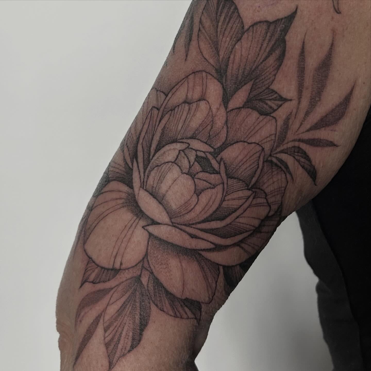 Peony black and grey tattoo on the forearm by Whitney Harbin