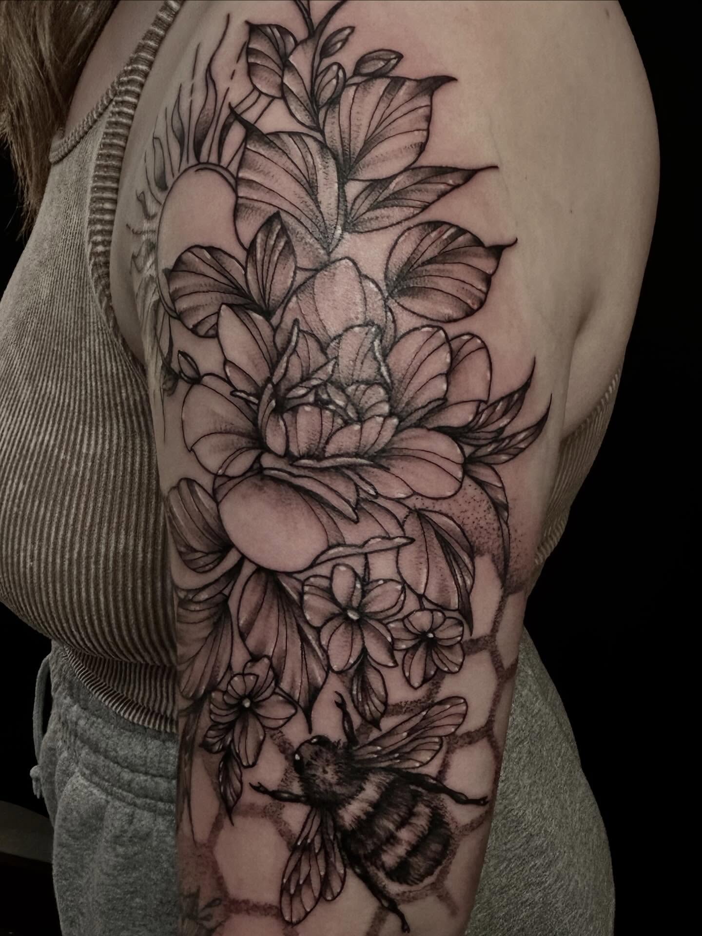 Flowers and bee realism tattoo on the shoulder by abby ☽ marie