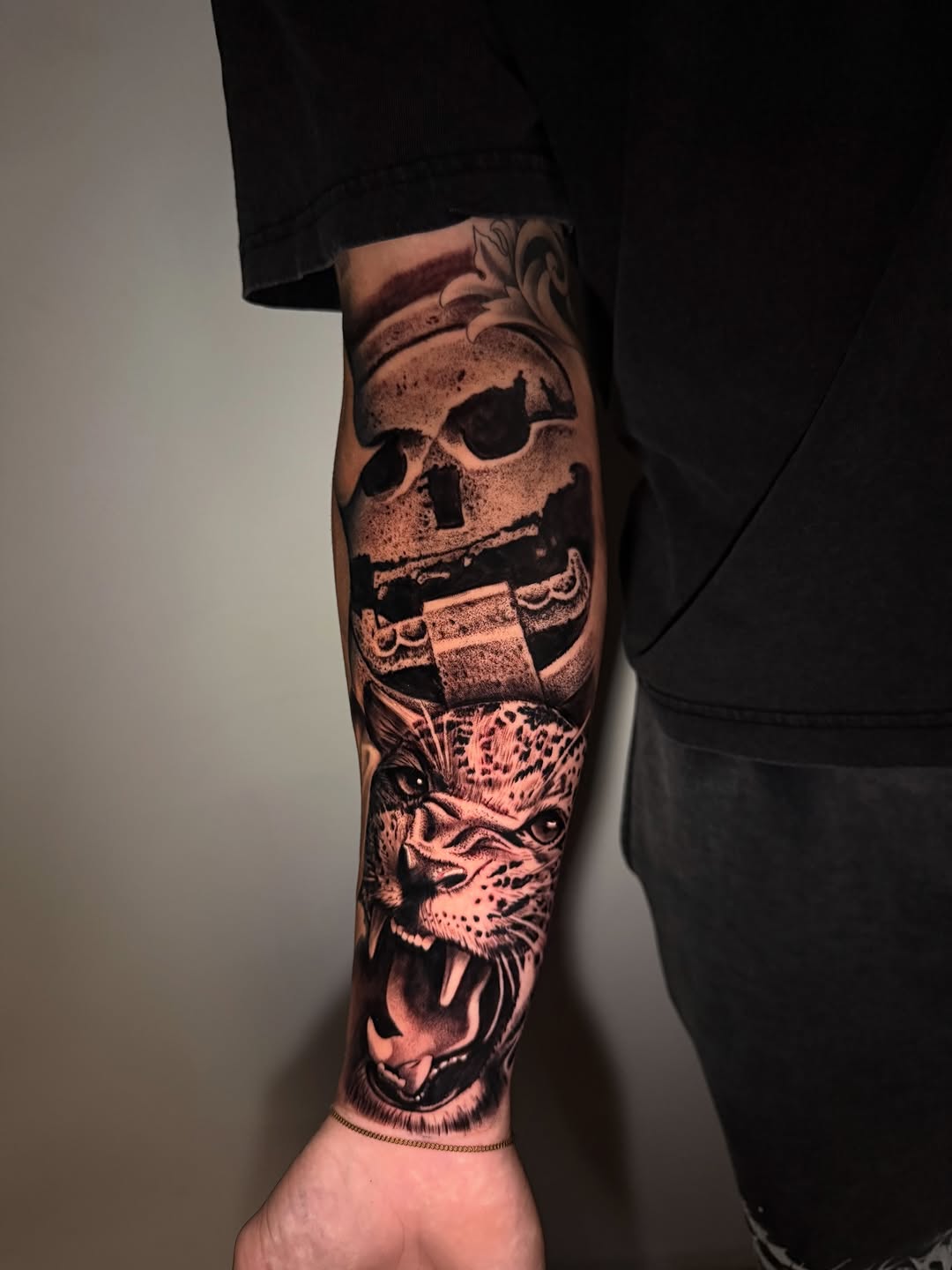 Skull and jaguar realism tattoo on the forearm by inkzombi