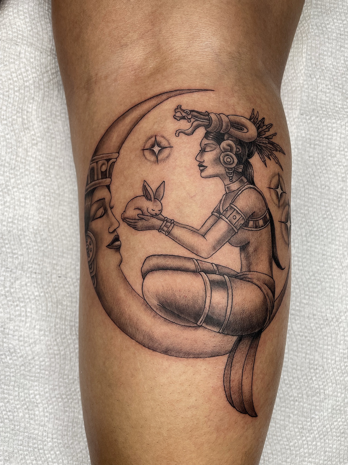 Mythical figure with rabbit realism tattoo on the thigh by Alex Ortiz