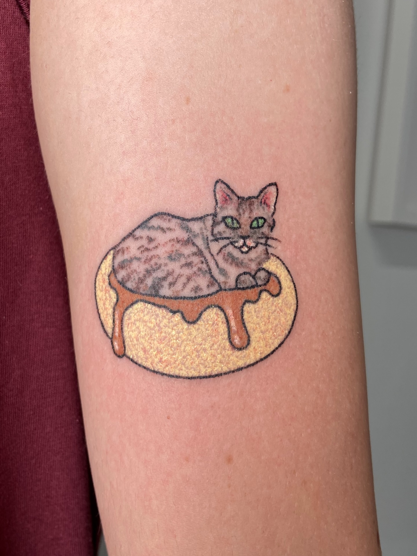Cat on donut dotwork tattoo on the forearm by Kasia ✨jedyny taki handpoke w katowicach✨