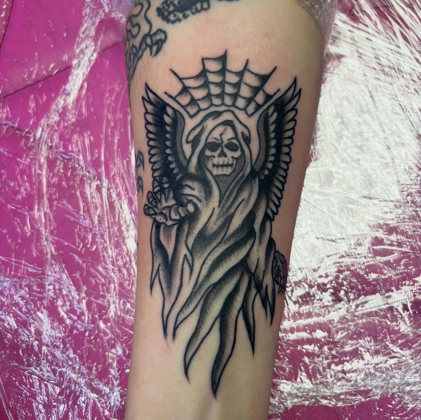 Grim reaper black and grey tattoo on the forearm by 18 and older High End Tattoo