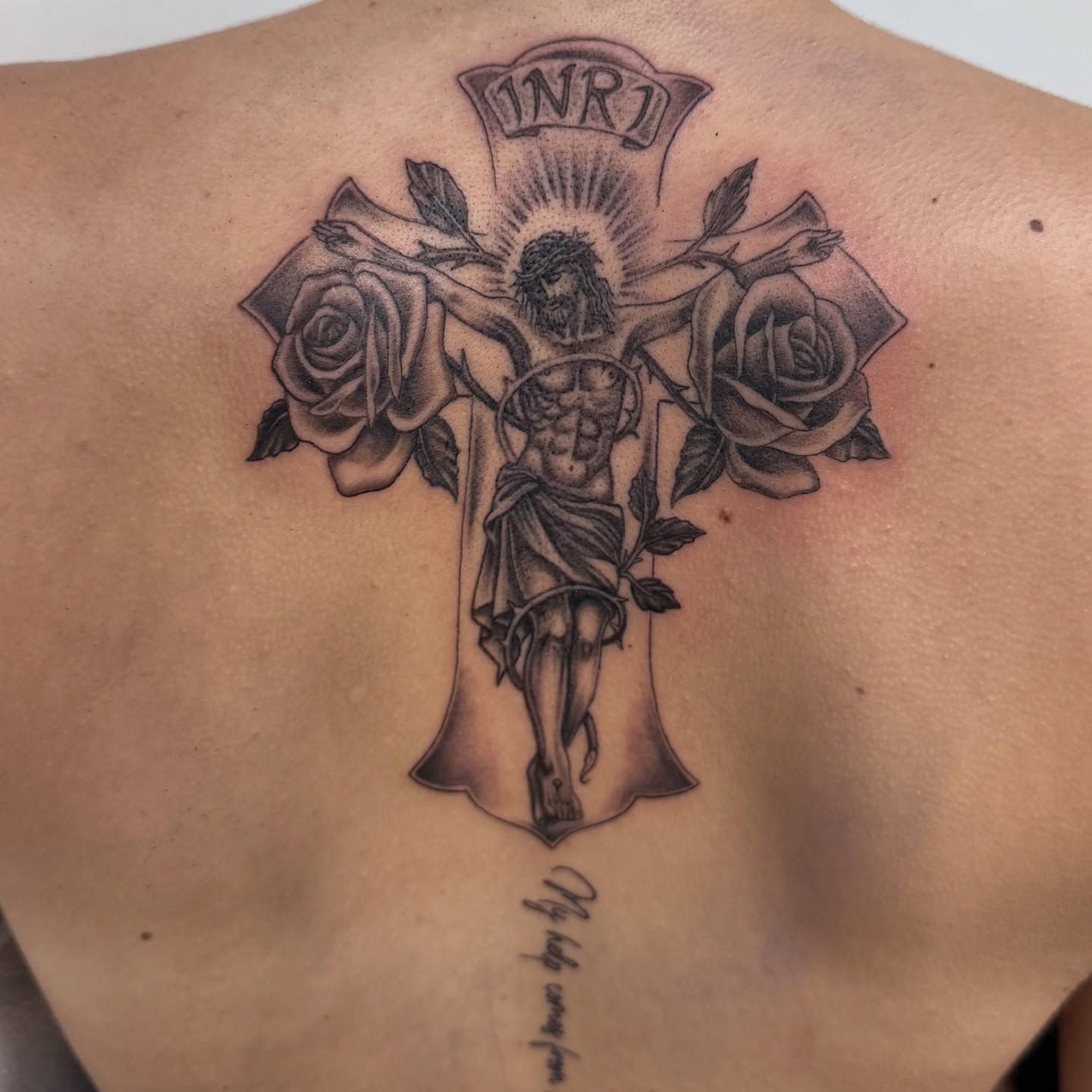 Cross with Jesus and roses black and grey tattoo on the back by Eva, Matawan, New Jersey