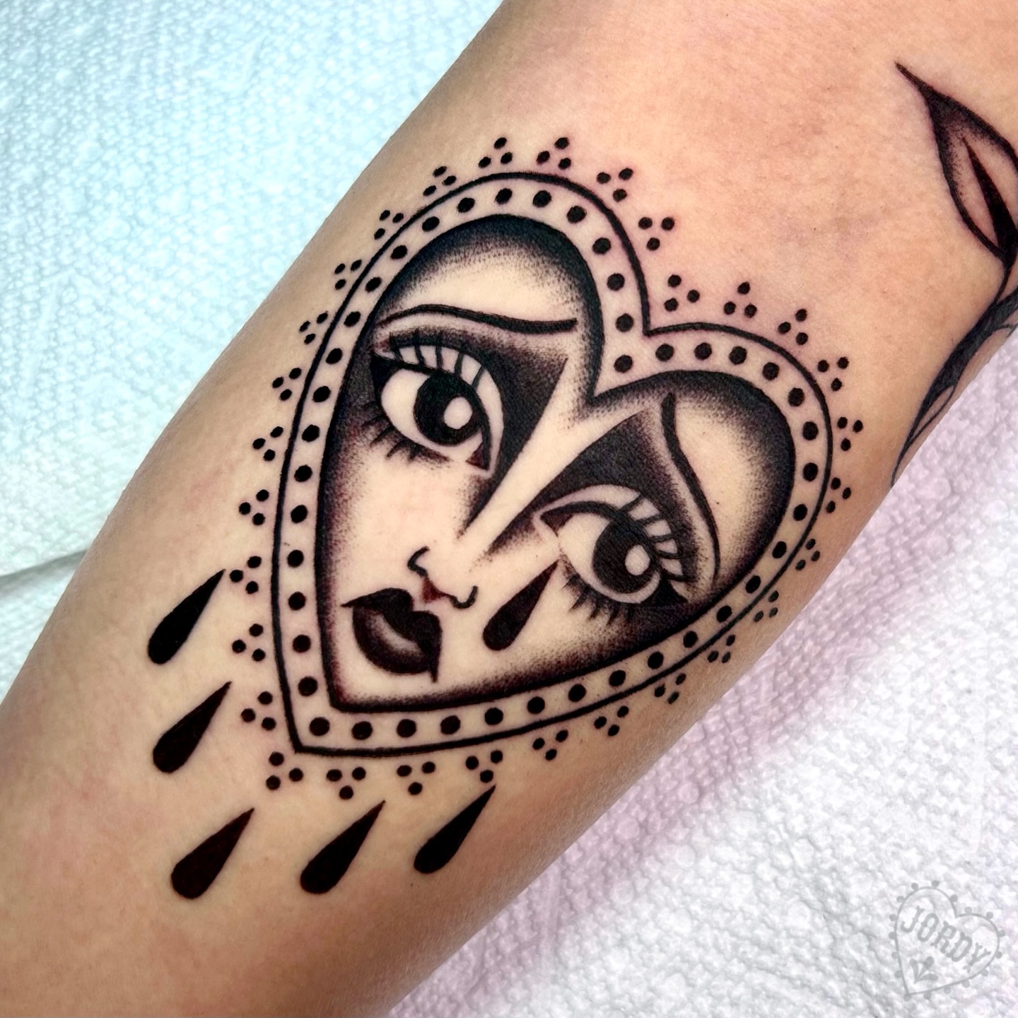 Abstract face dotwork tattoo on the forearm by jordy, Philadelphia, Pennsylvania