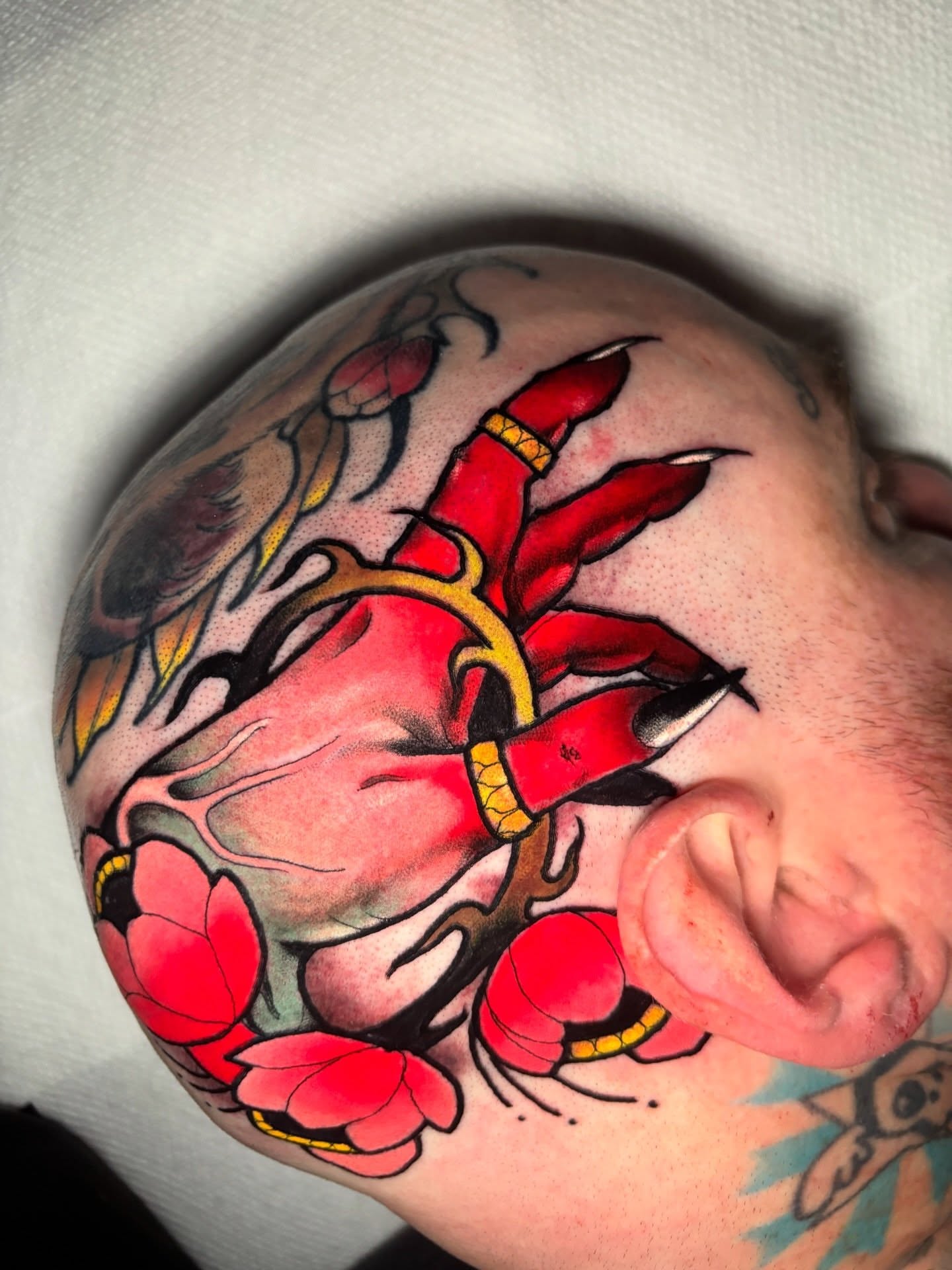 Heart with claws American traditional tattoo on the shoulder by Matt Stolzenburg