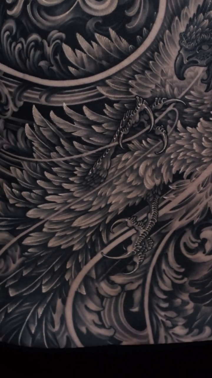 Phoenix with ornate background Japanese tattoo on the back by Yujin Ju