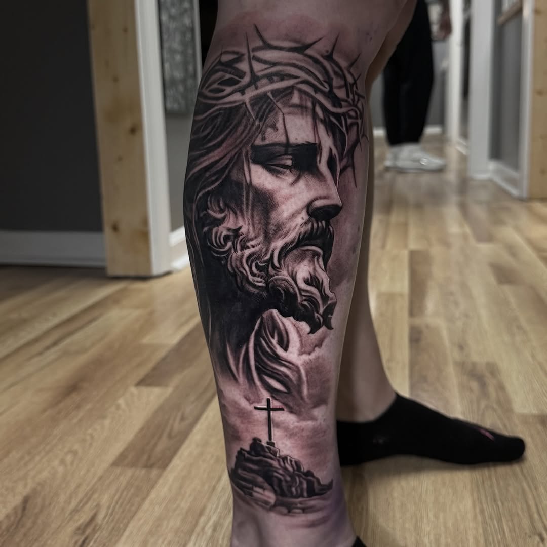 Surrealism tattoo on the calf by Jake Fujimura
