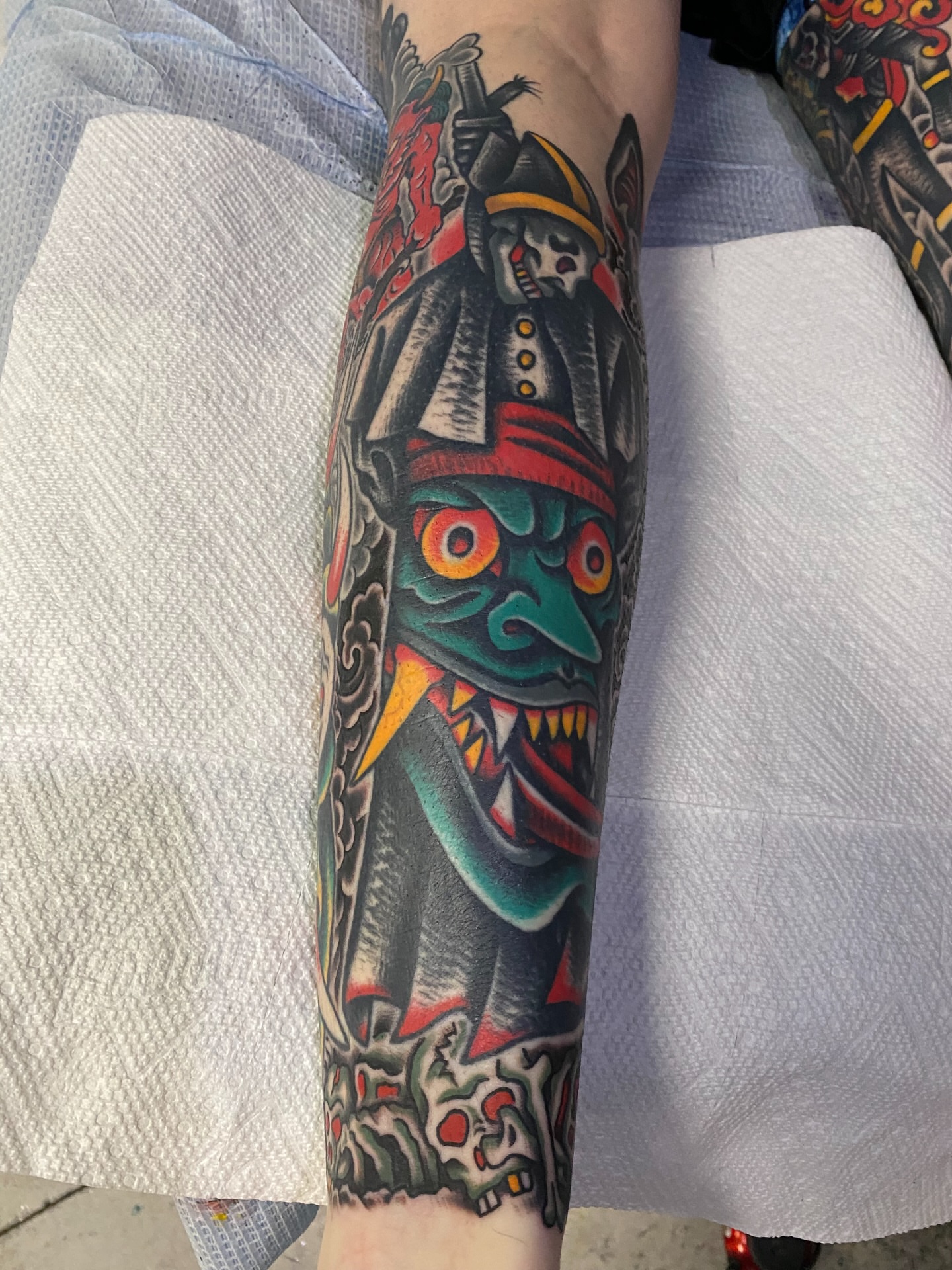 Mask American traditional tattoo on the forearm by sean drennen