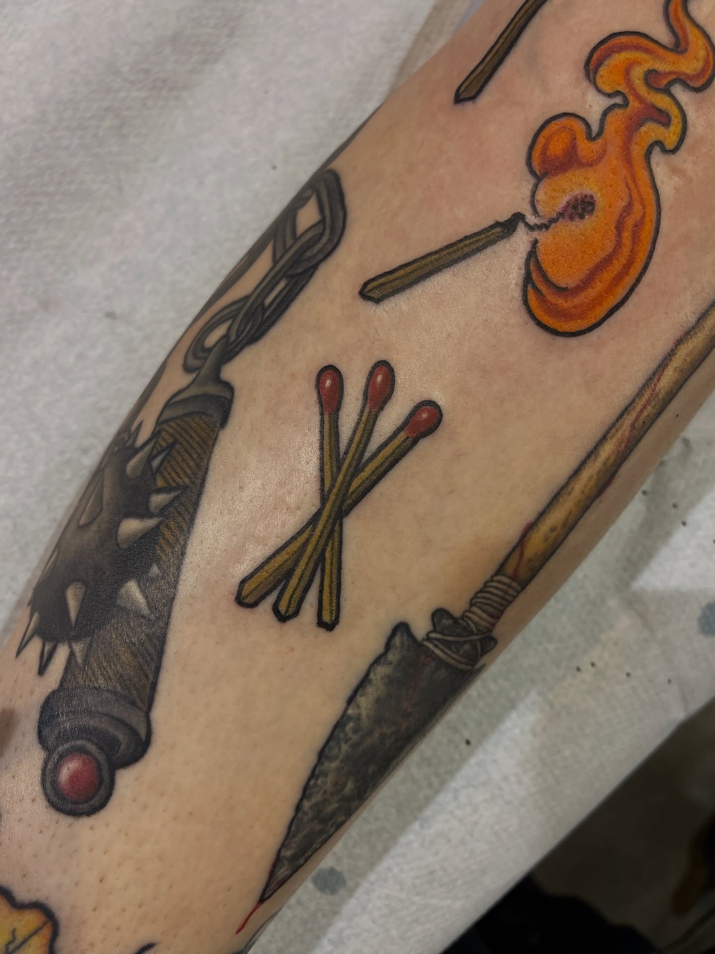 Matches and flame American traditional tattoo on the forearm by Dale Callahan, Olympia, Washington