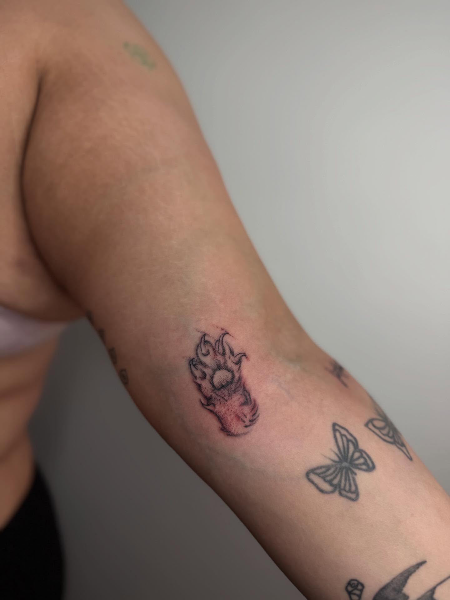 Flame black and grey tattoo on the forearm by Carson Mccullers ✨