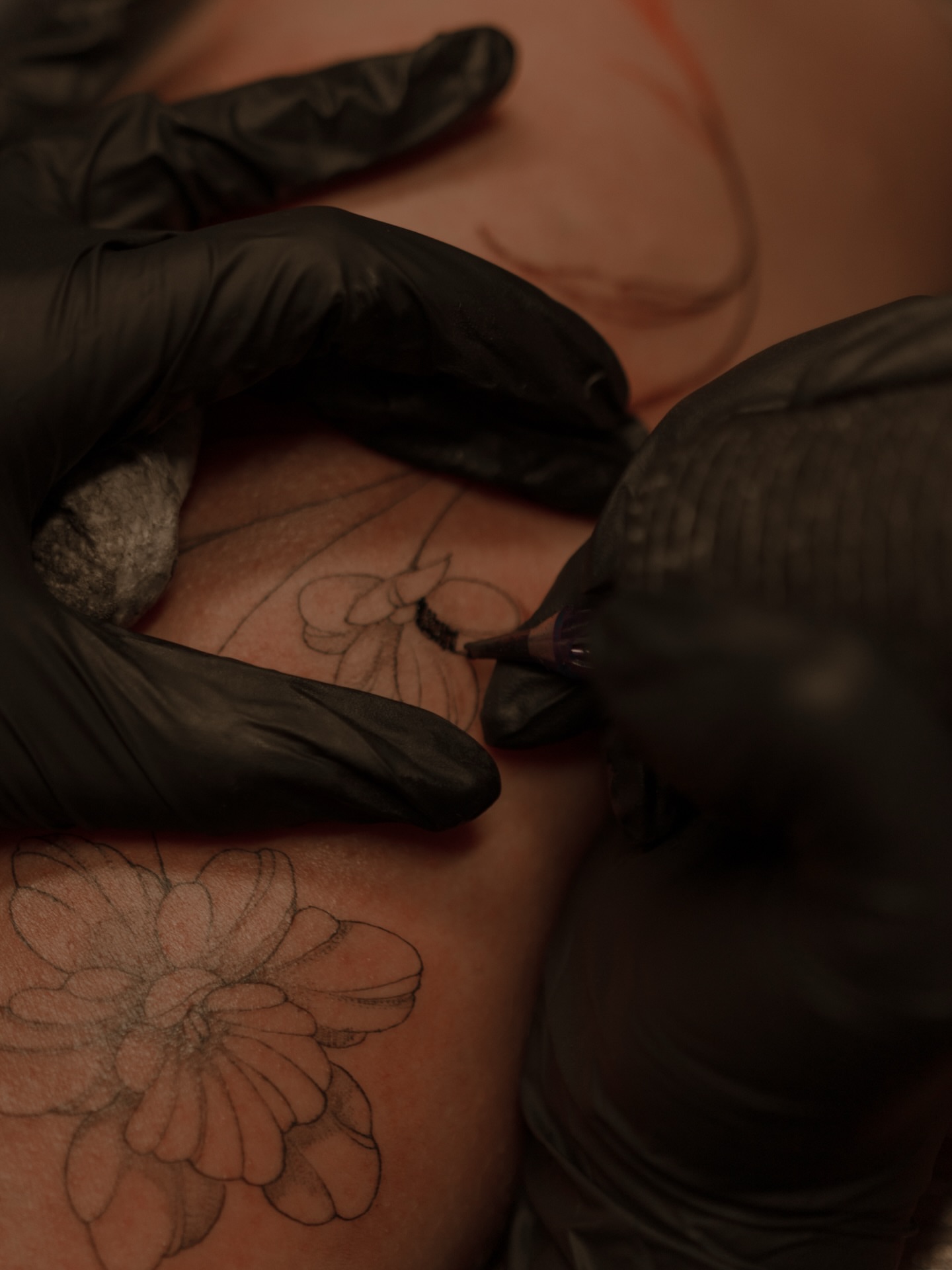 Flower black and grey tattoo on the upper arm by Jen- San Antonio tattoo artist