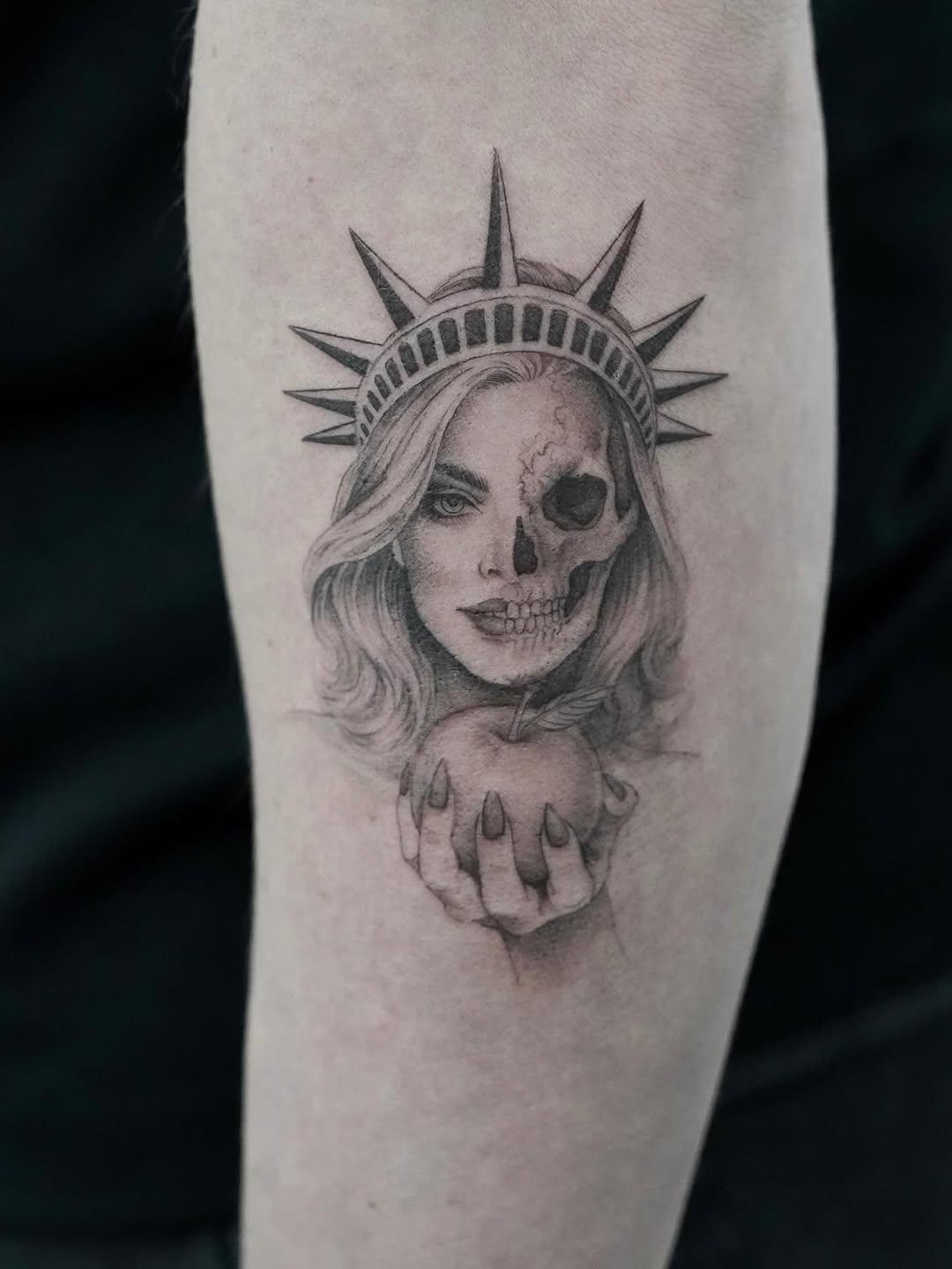 Half woman half skull with apple realism tattoo on the forearm by Julia