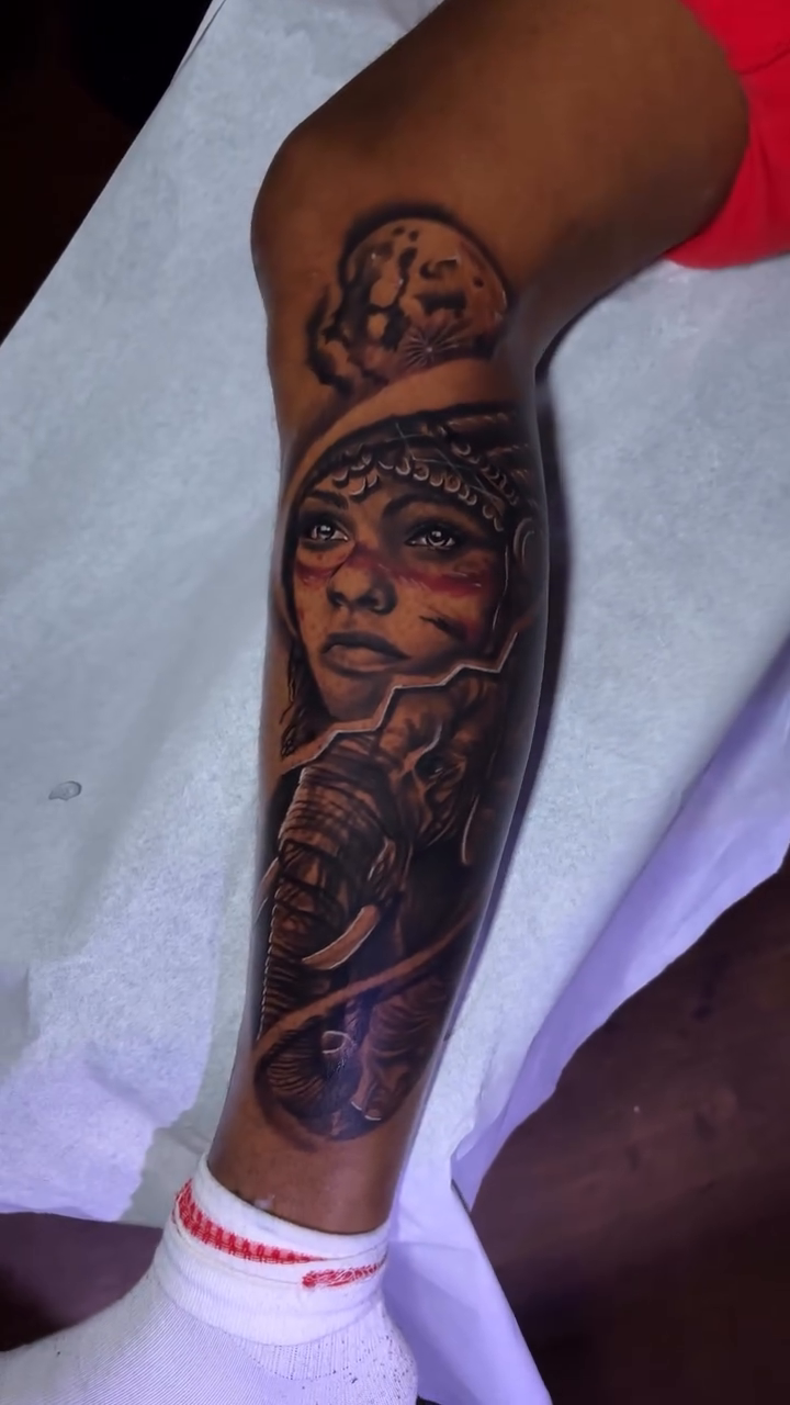 Native American woman and elephant realism tattoo on the forearm by Chicago Tattoo Artist