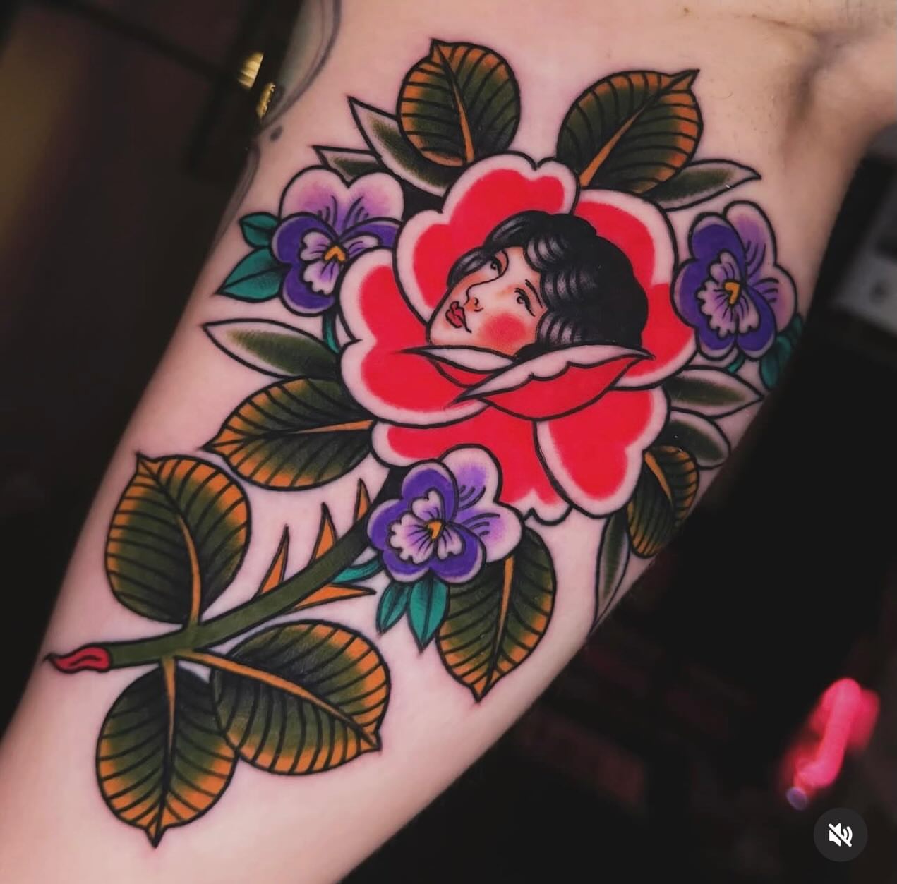 Flower and woman American traditional tattoo on the forearm by Nikki Bee