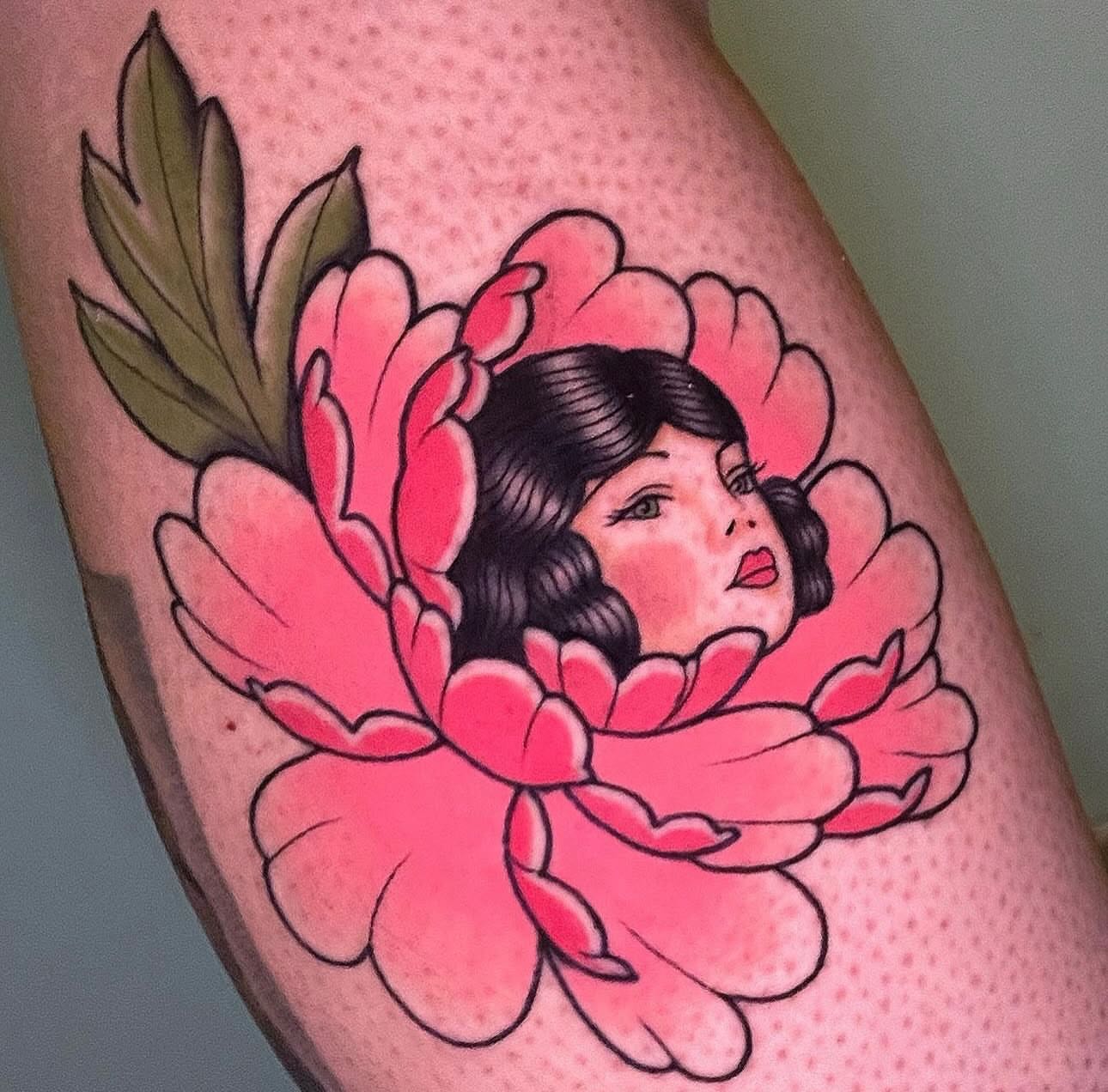 Flower girl American traditional tattoo on the thigh by Nikki Bee