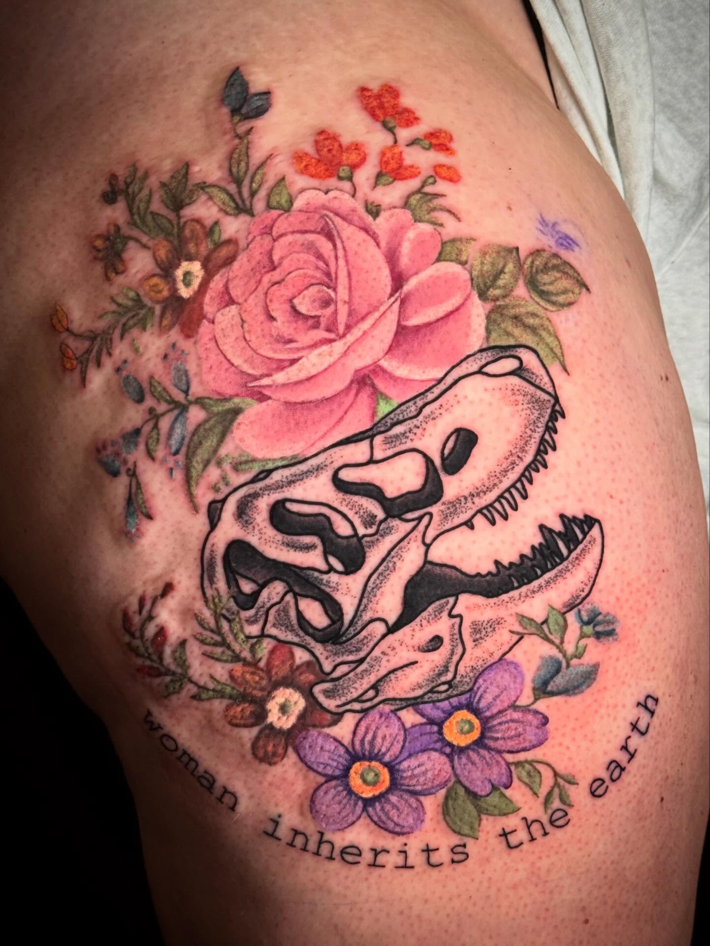Skull and flowers realism tattoo on the thigh by Suzanne B