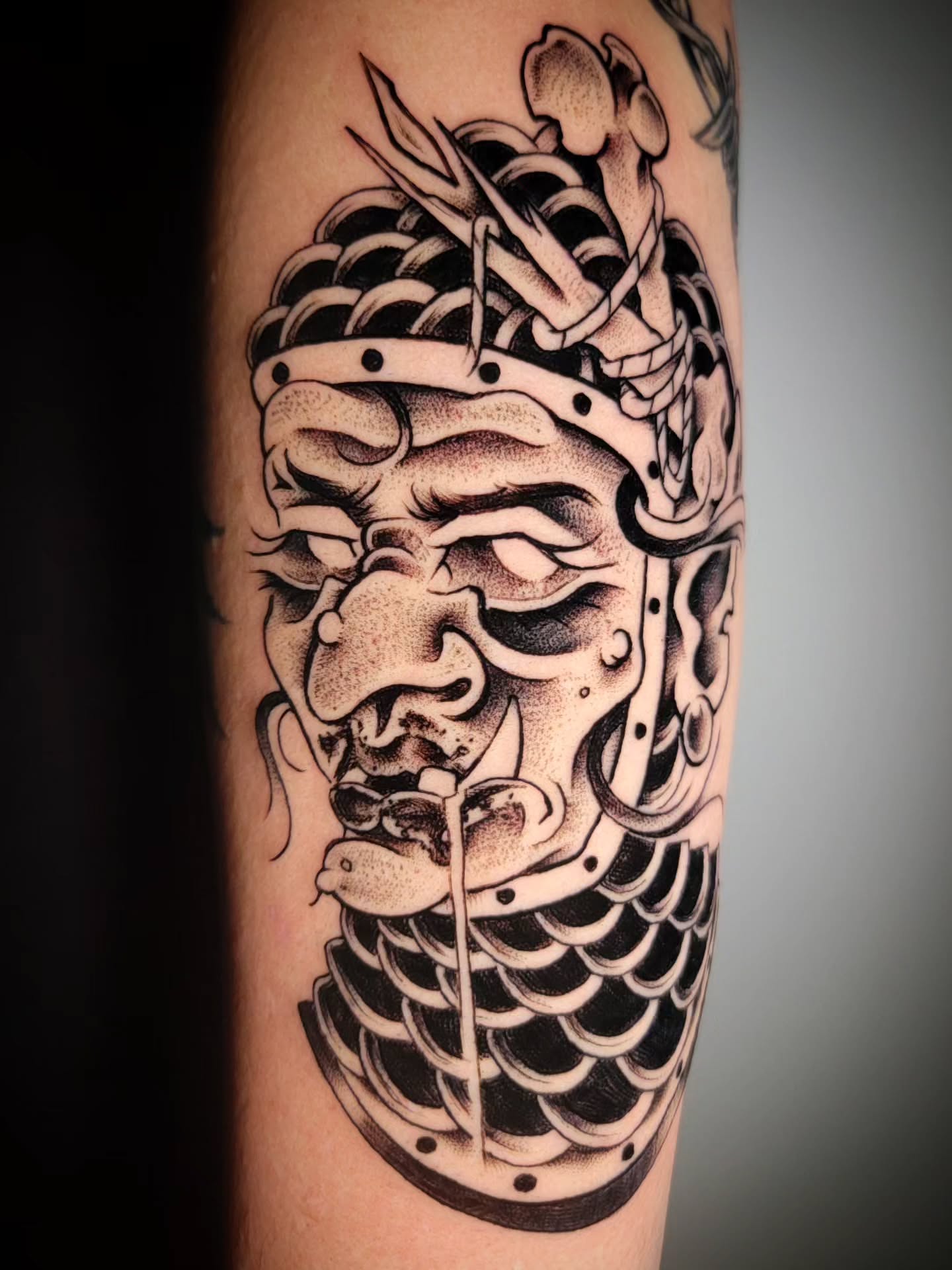 Mask dotwork tattoo on the forearm by Randyz Tattyz
