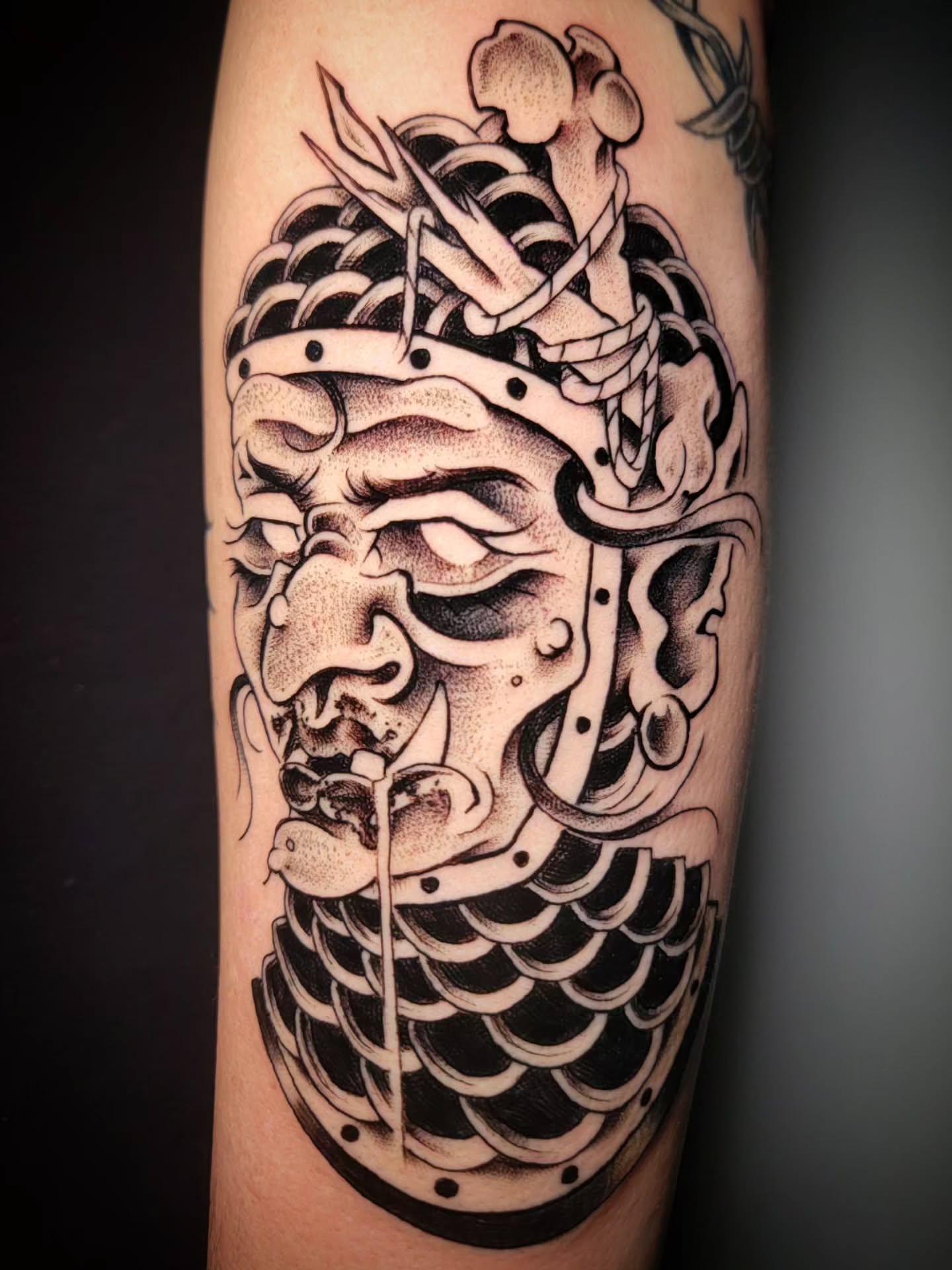 Mask dotwork tattoo on the forearm by Randyz Tattyz