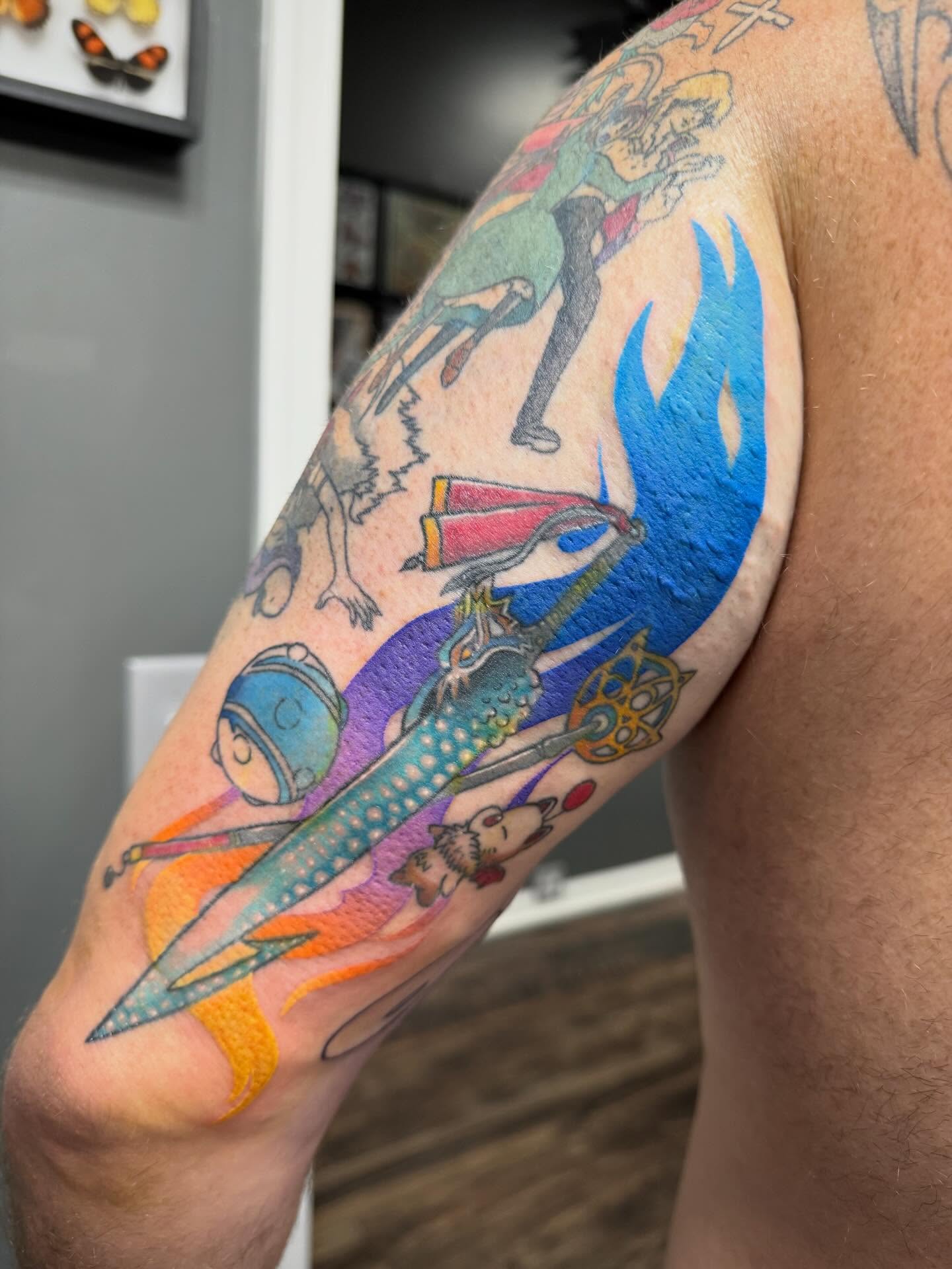 Space-themed fantasy new school tattoo on the upper arm by Abby Hofman