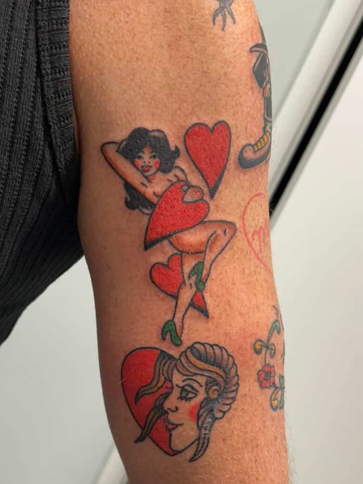 Heart and woman American traditional tattoo on the forearm by Tawni Bender