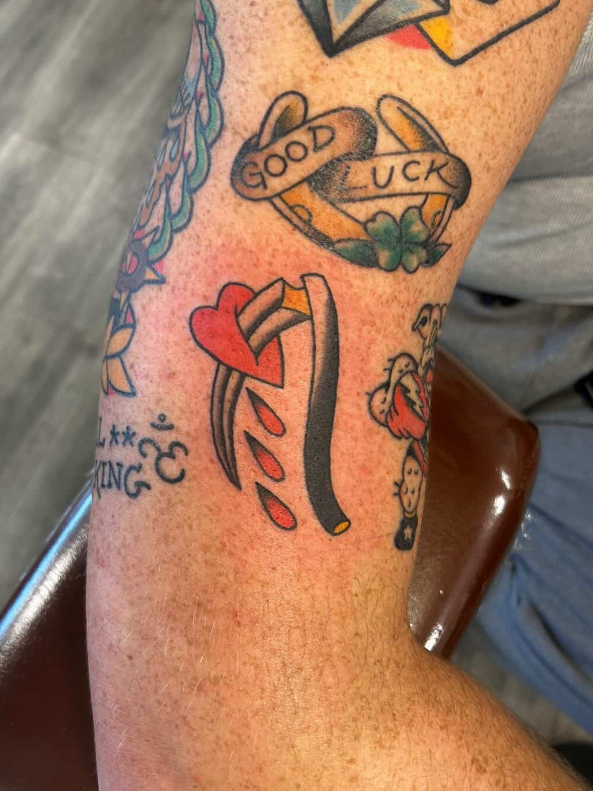 Good luck charm American traditional tattoo on the forearm by Tawni Bender