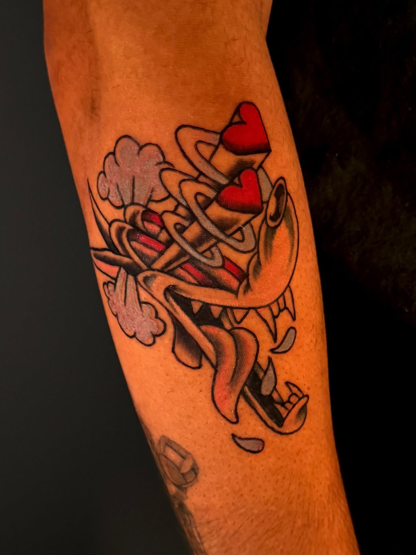 Abstract hearts and swirls new school tattoo on the forearm by Dallas Tattoo Artist