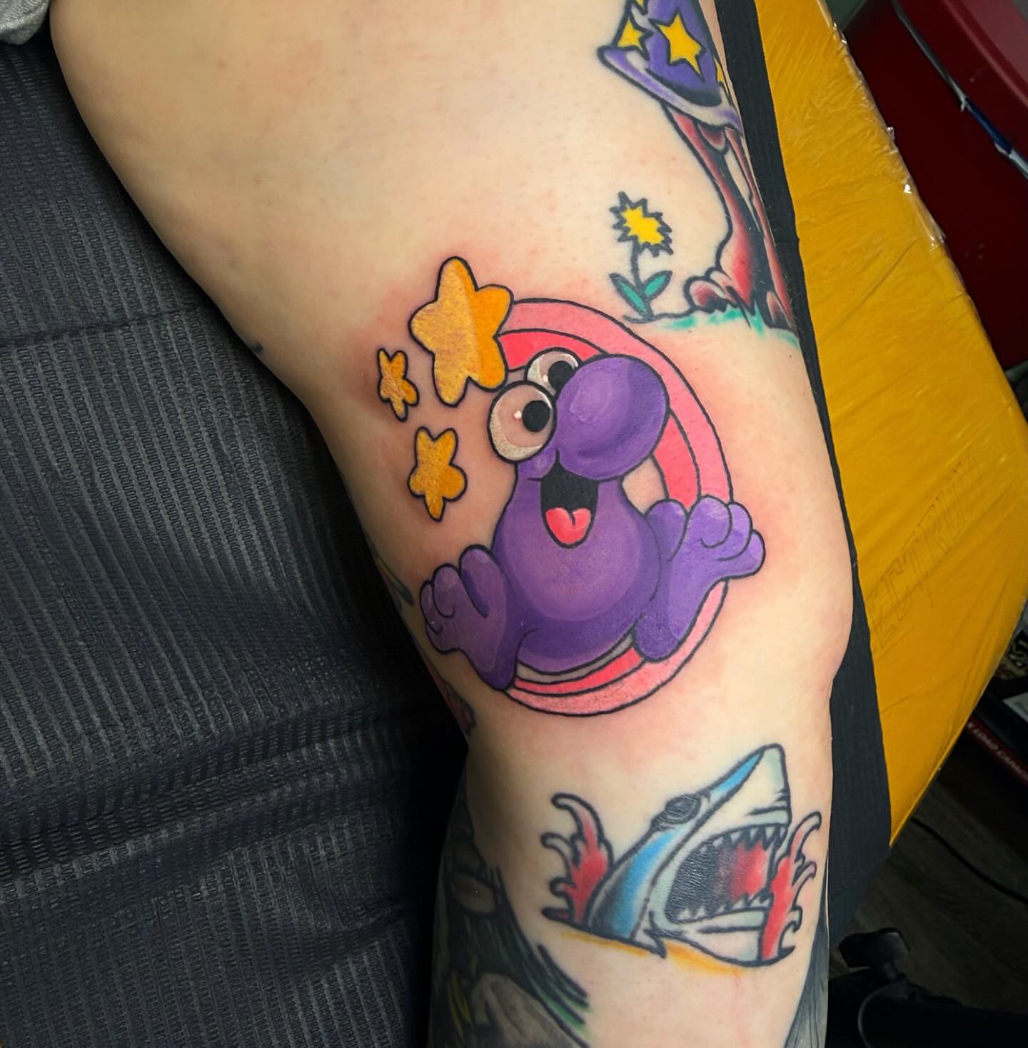 Purple creature with stars new school tattoo on the thigh by Abigail Lewis