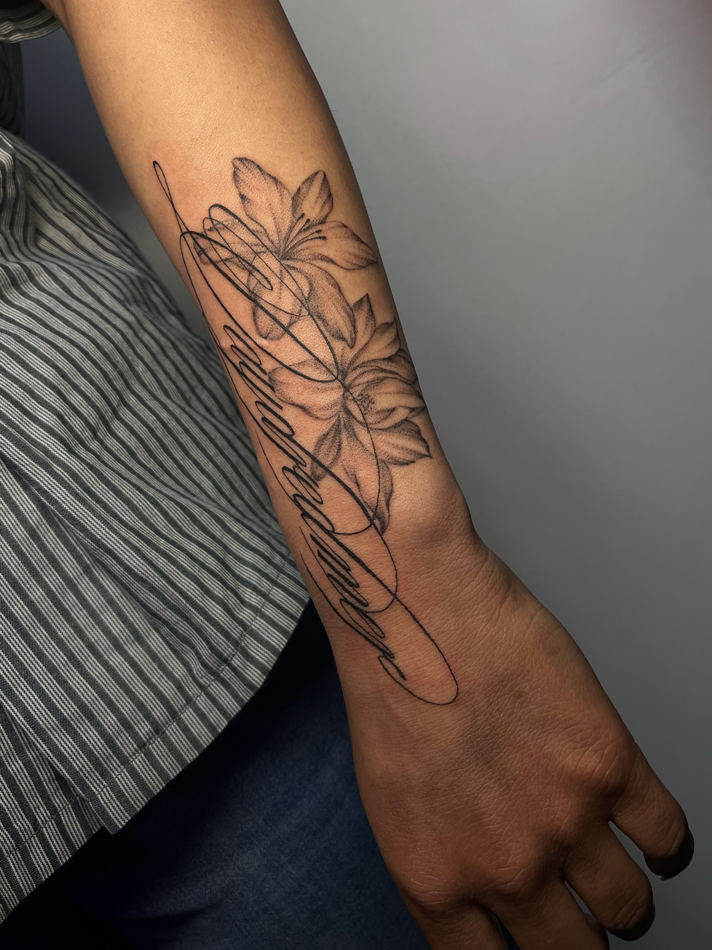 Lotus flowers black and grey tattoo on the forearm by MK
