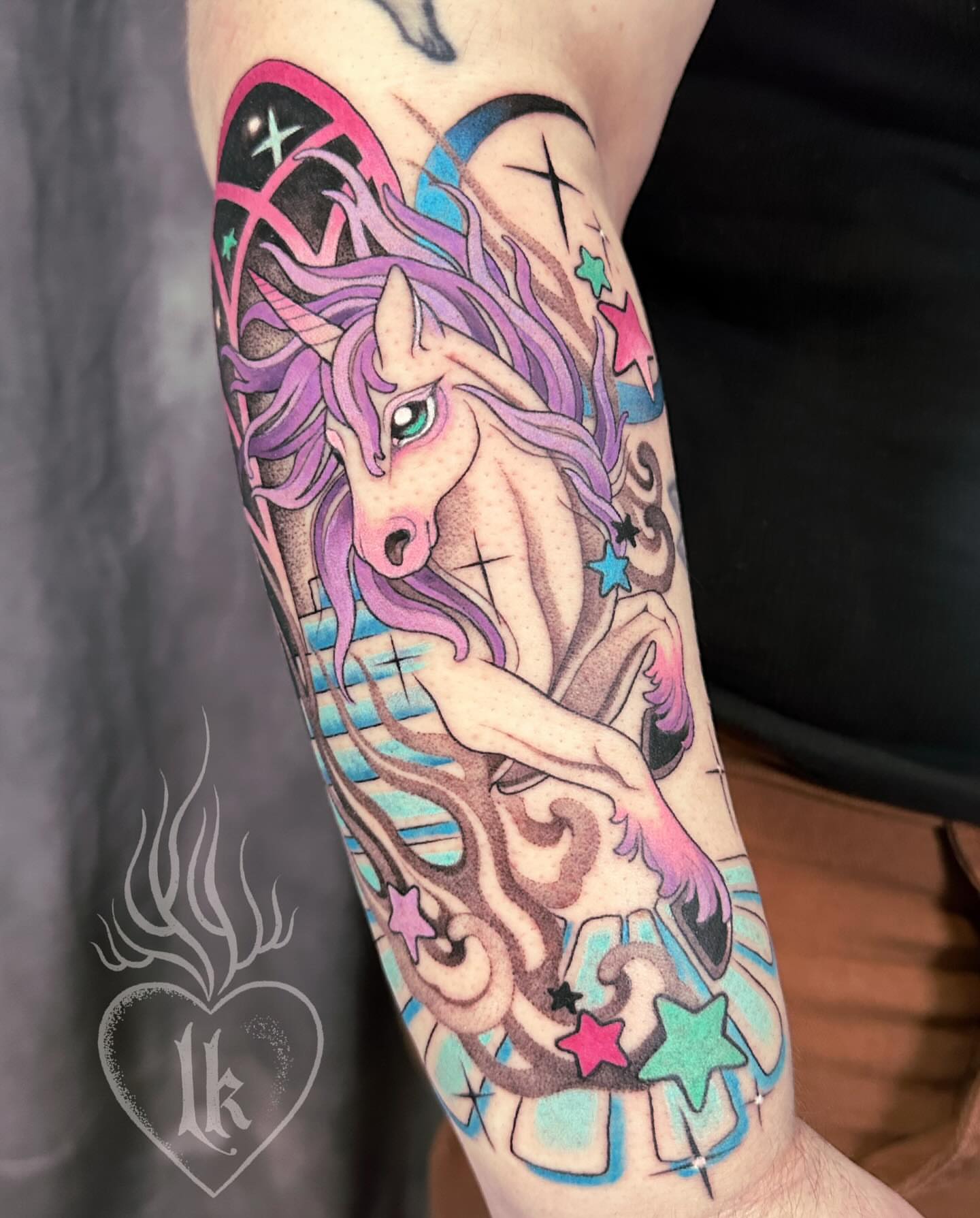 Unicorns new school tattoo on the forearm by Hillary