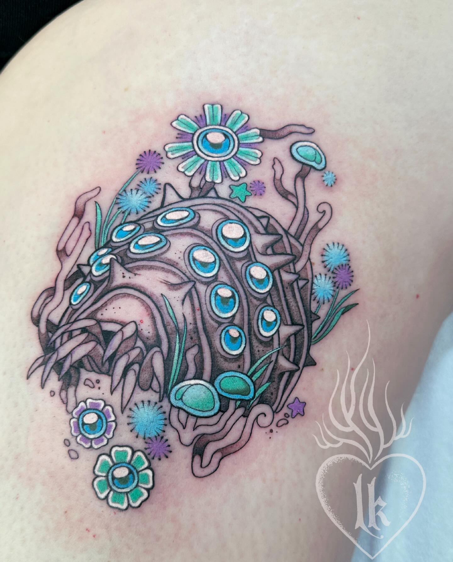 Sea urchin new school tattoo on the shoulder by Hillary