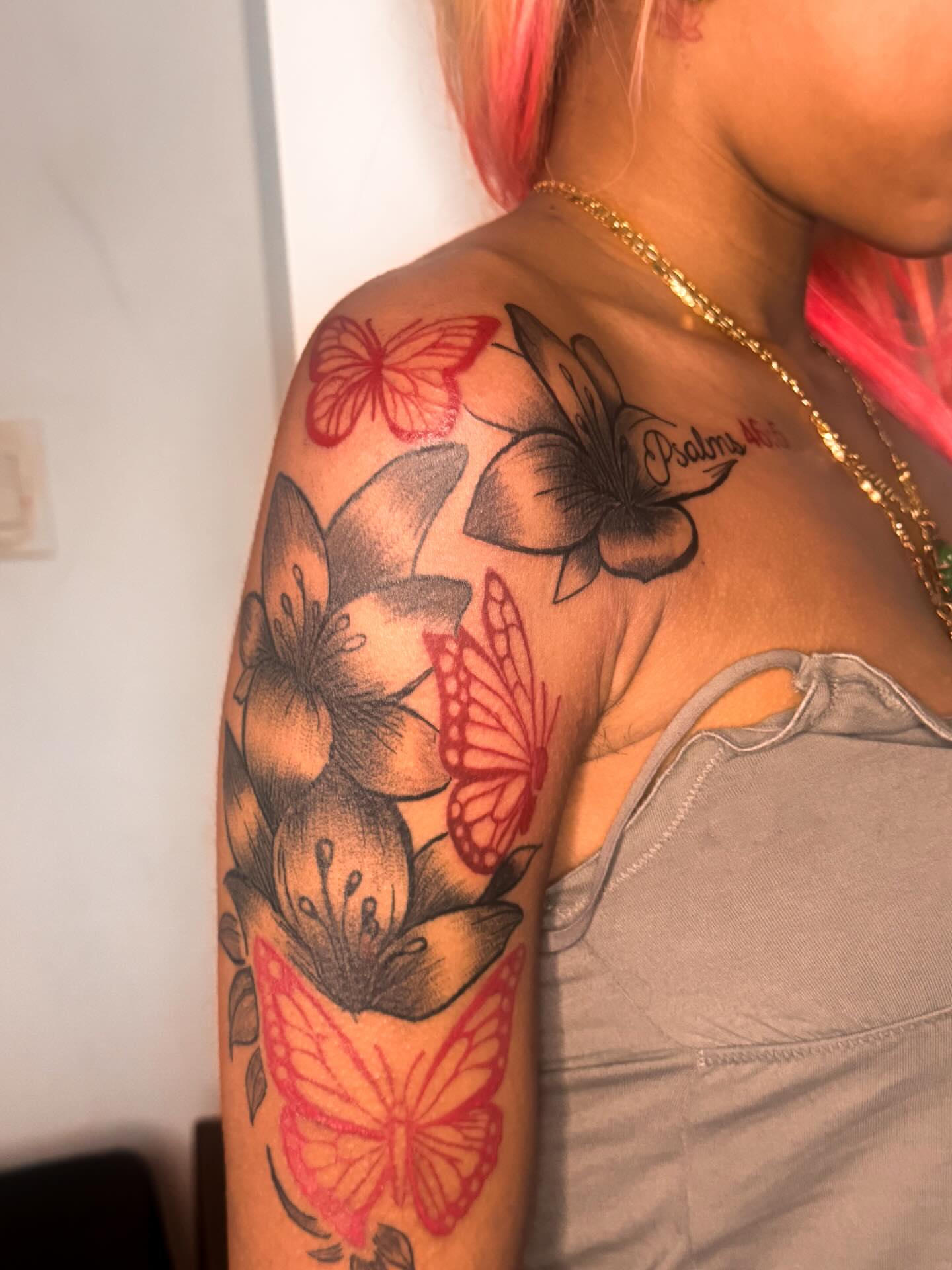 Flowers and butterflies realism tattoo on the shoulder by Comet