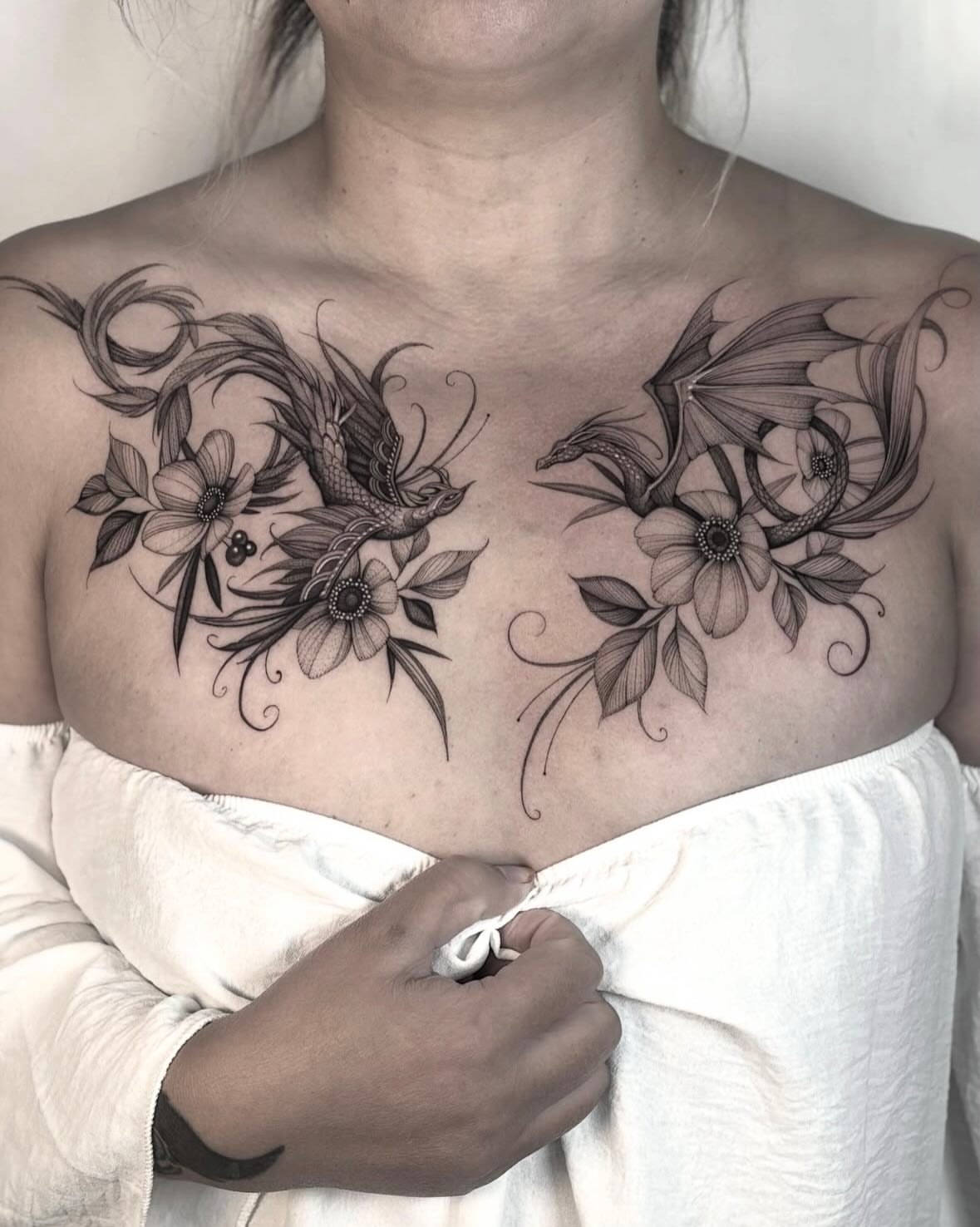 Floral dragon ornamental tattoo on the chest by Brittney Naami, San Francisco, California