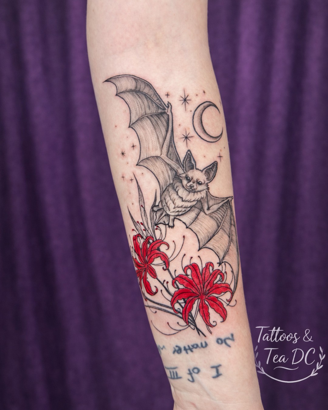 Bat and flowers realism tattoo on the forearm by Tattoos & Tea DC, Arlington, Virginia
