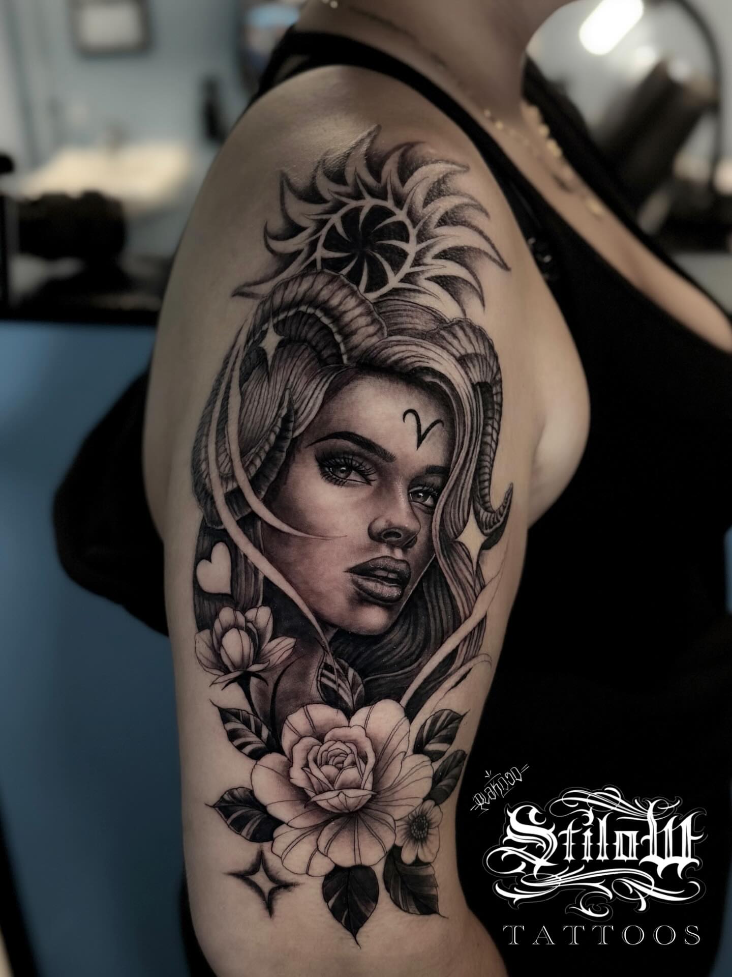 Woman with flowers realism tattoo on the shoulder by Stilow Memphis Tattoo Artist, Memphis, Tennessee