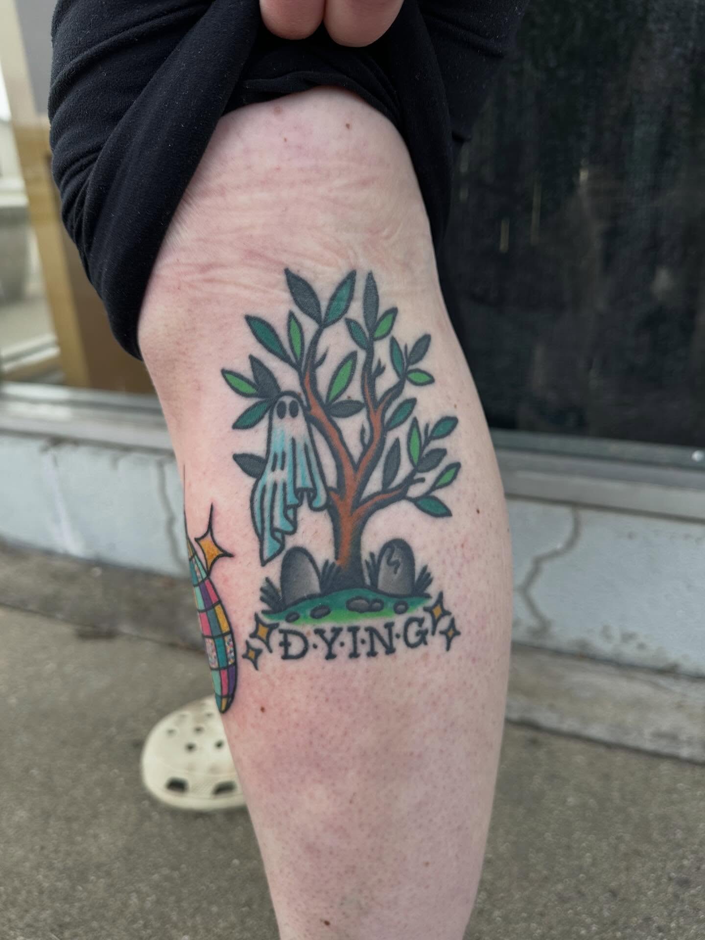 Tree with ghost American traditional tattoo on the forearm by Whitney Creep Tattoos