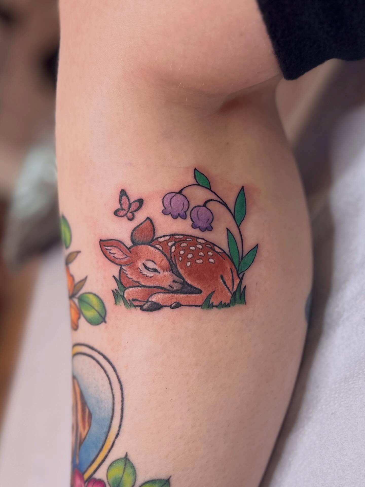 Deer and flowers new school tattoo on the forearm by Dani Di Pietrantonio