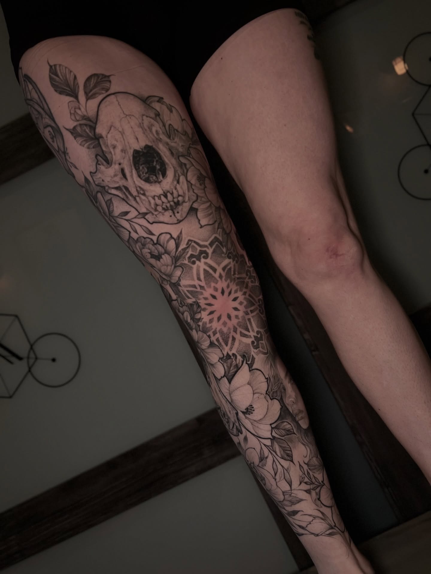 Skull and floral mandala geometric tattoo on the forearm by Dominick Cali, East Islip, New York