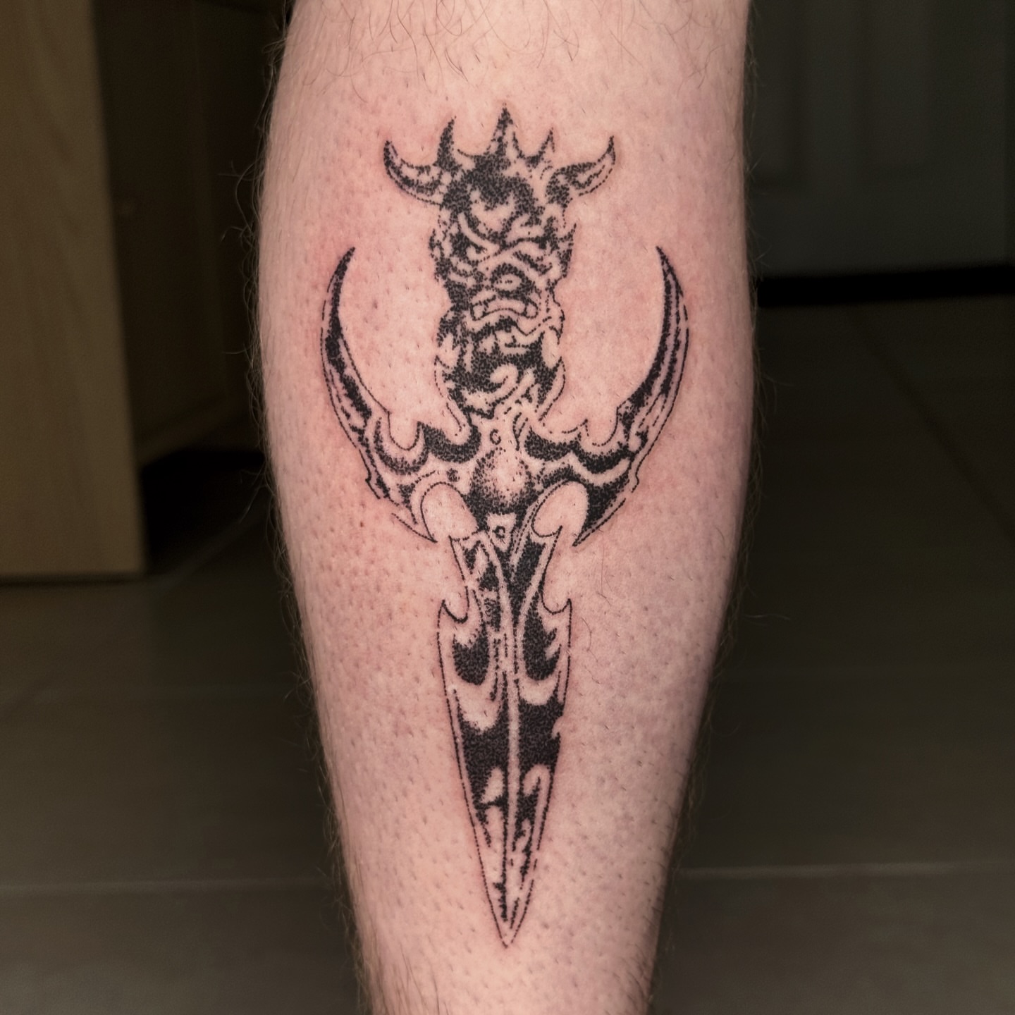 Demon mask black and grey tattoo on the forearm by Joint Killer