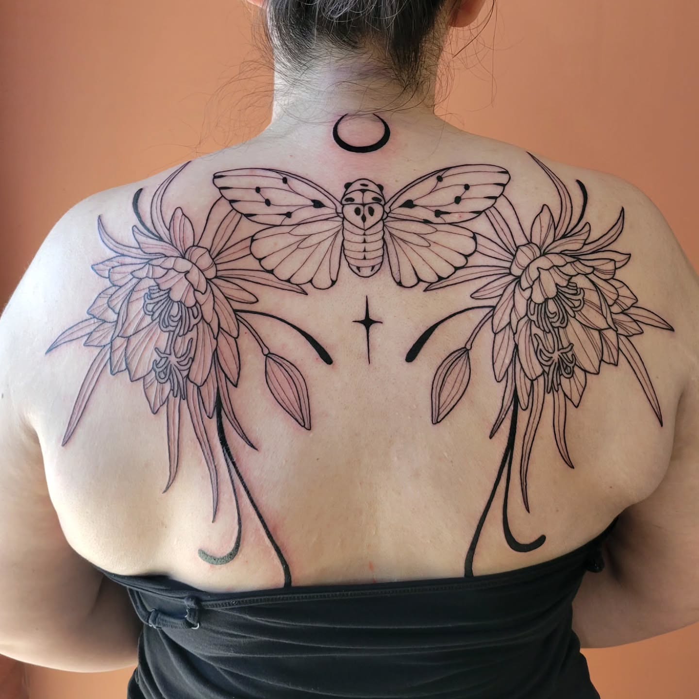 Moth and flowers black and grey tattoo on the back by Taylor