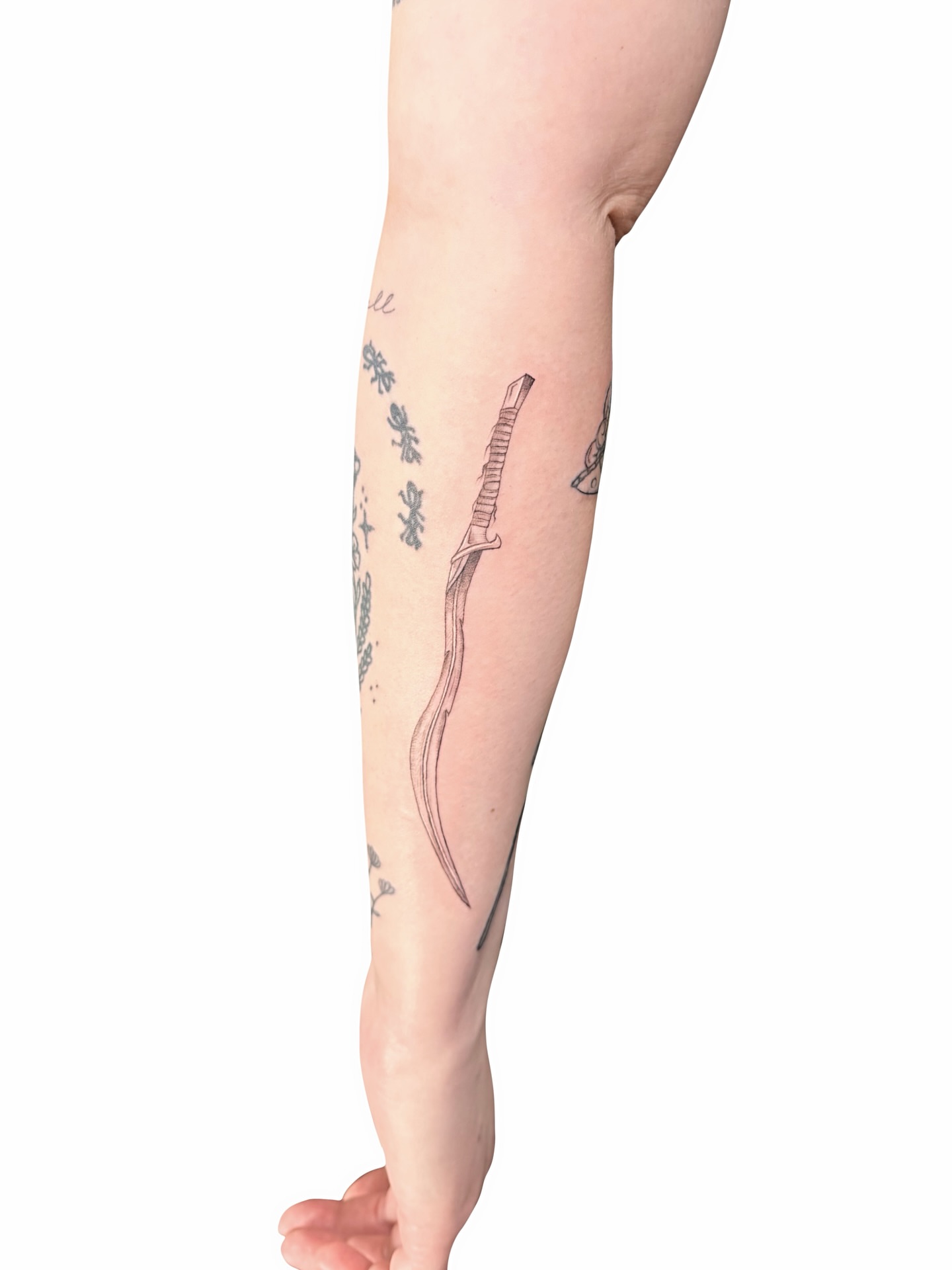 Knife black and grey tattoo on the forearm by Fionna, Seattle, Washington