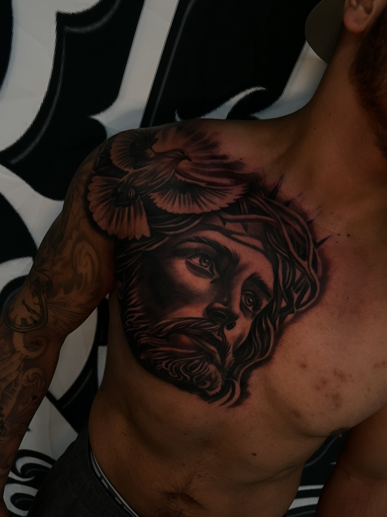 Religious figure realism tattoo on the chest by Daniel Michael Perez