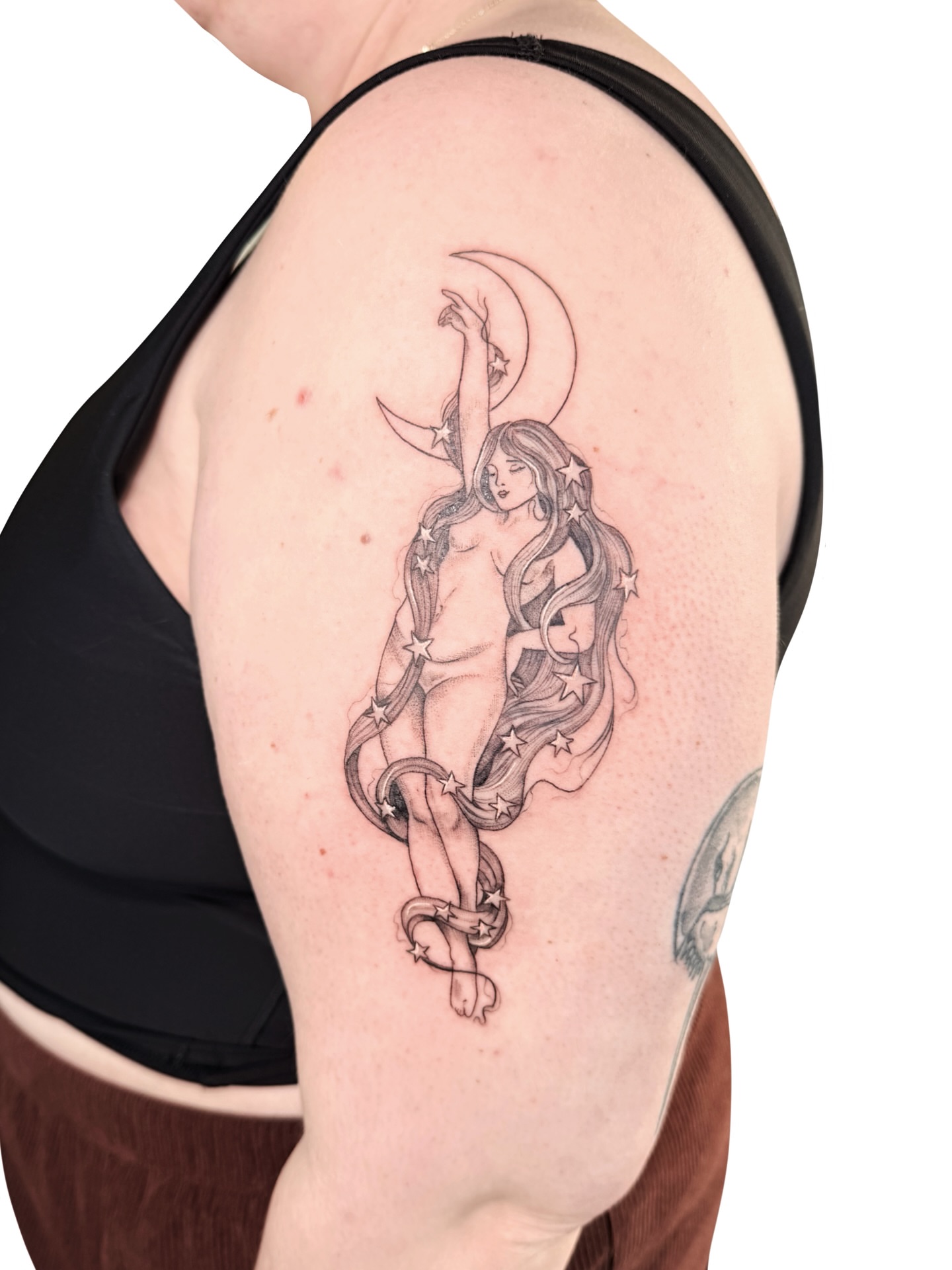 Nude woman with stars black and grey tattoo on the shoulder by Fionna, Seattle, Washington