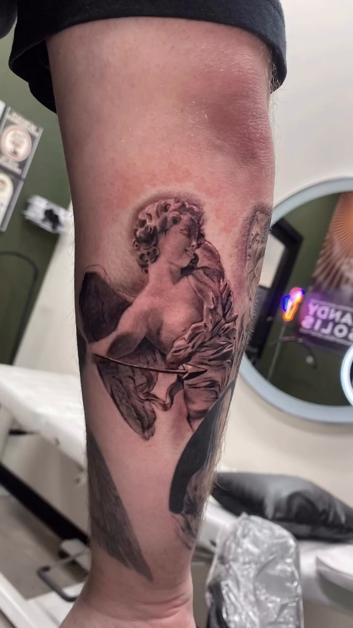 Cherub statue realism tattoo by Jazz