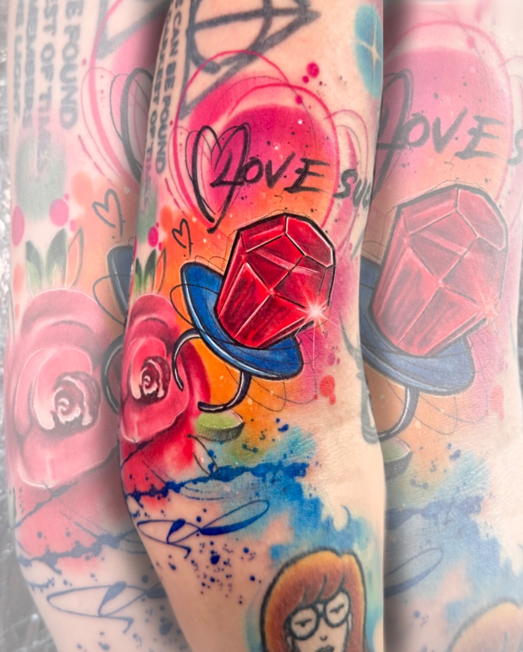 Gemstone watercolor tattoo on the forearm by Alena Petunia