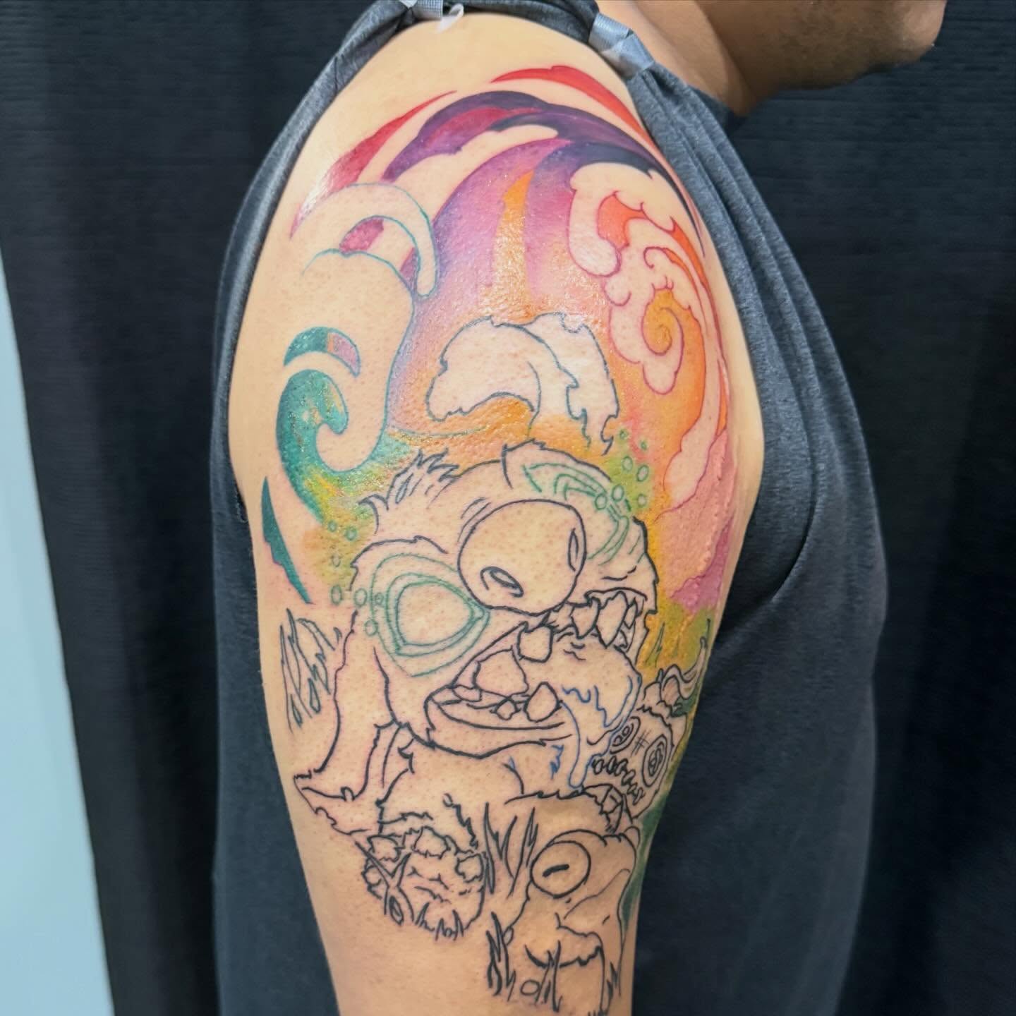 Monster dotwork tattoo on the upper arm by Devon Beyer, Mission, Kansas