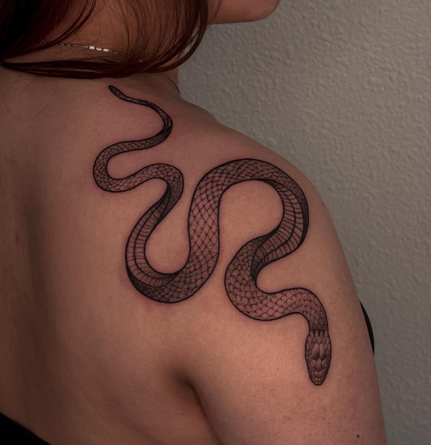 Snake black and grey tattoo on the shoulder by Las Vegas Tattoo Artist