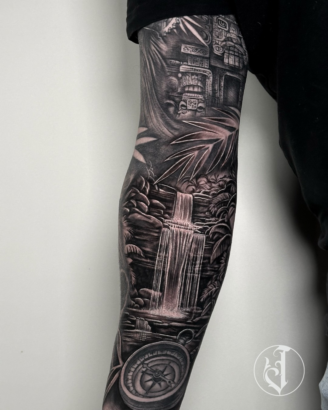 Jungle waterfall temple realism tattoo on the forearm by Tattoos By Josh