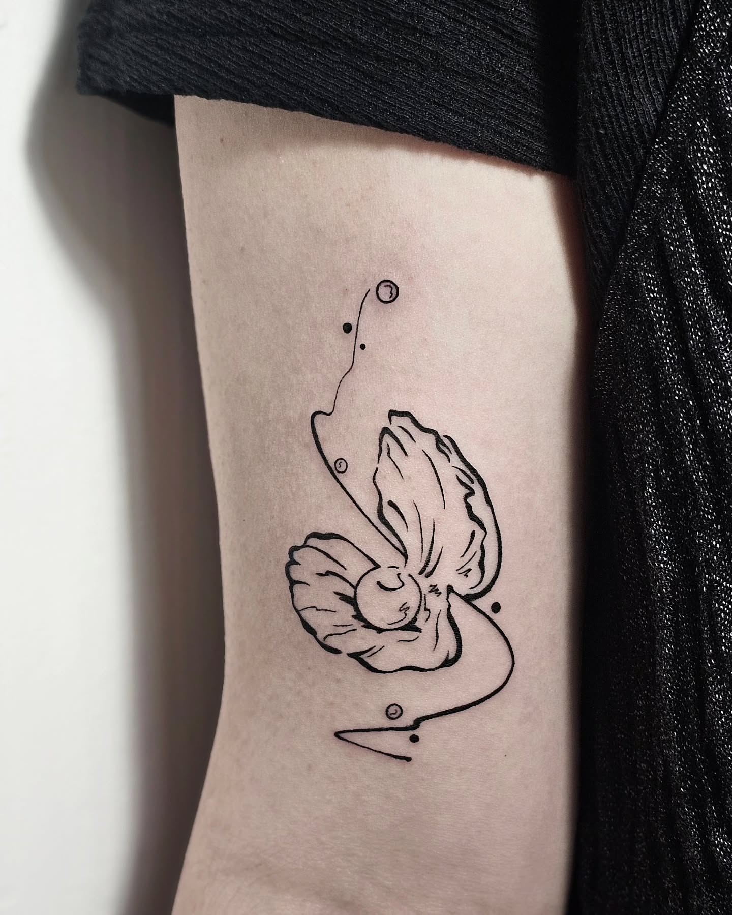 Tattoo by @draw.a_castle — minimalist, dotwork