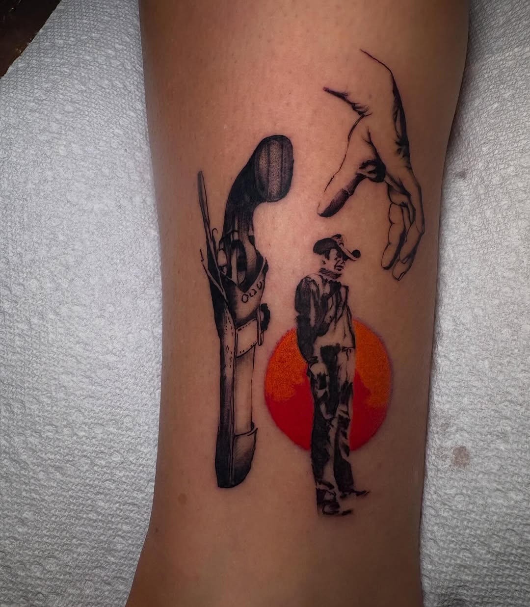 Gun, cowboy, hand, sun ignorant tattoo on the forearm by Haley Byers